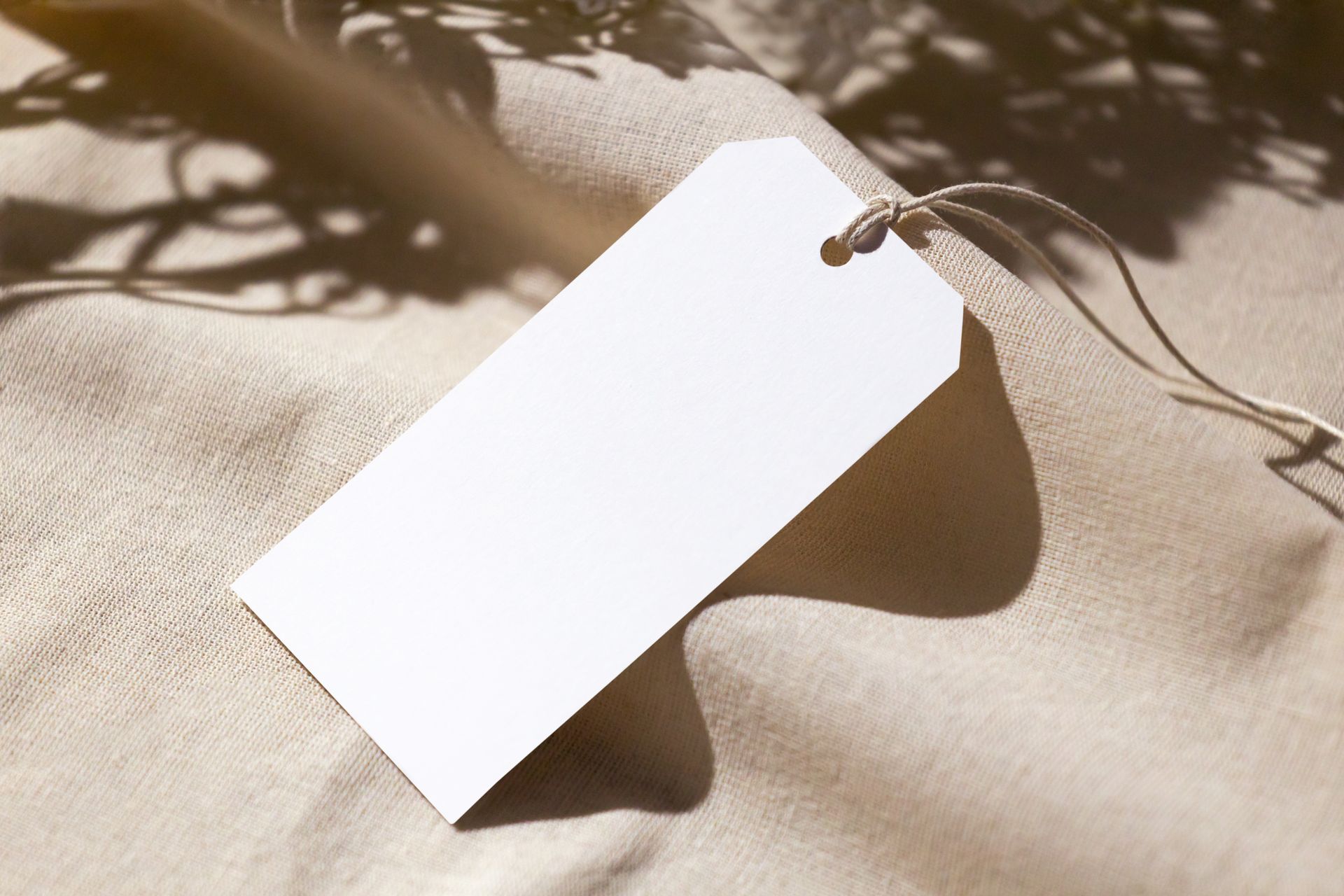 Blank paper hang tag on textile
